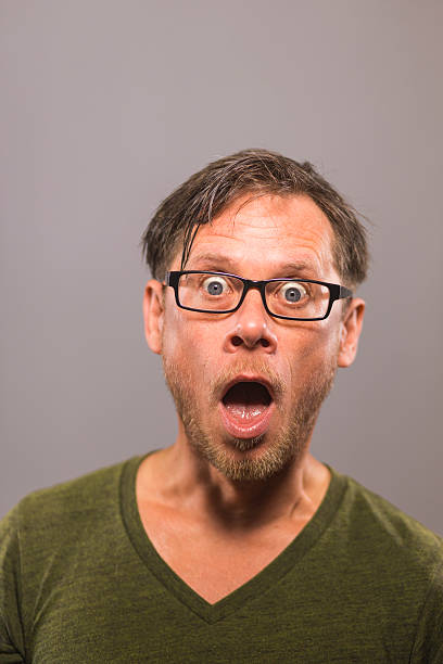 Shocked man with glasses stock photo
