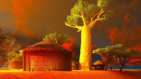 African village with traditional huts surrounded by baobab trees