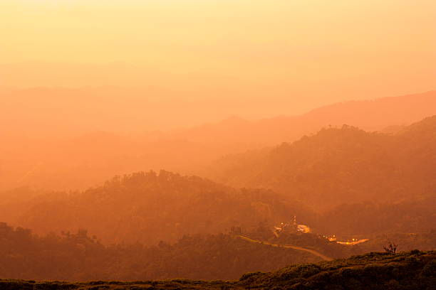 Beautiful moutain sunset foggy Beautiful moutain sunset foggy  for background kanchanaburi province stock pictures, royalty-free photos & images