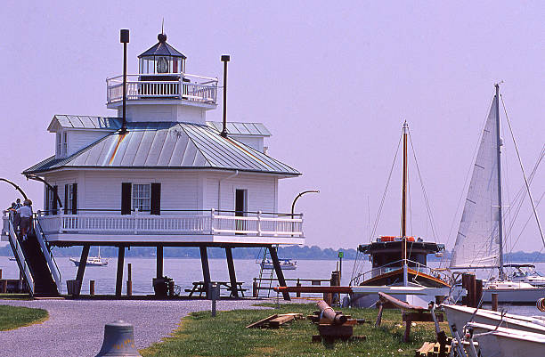 Roanoke Island Marshes Lighthouse is located on the lovely waterfront park on the Arbemarle Sound. Two other lighthouses built in the 1800s carried the Roanoke Marshes Light name and were lost or abandoned due to extensive and neglected repairs and a compromised foundation from the challenges of its environment. The current Roanoke Marshes Lighthouse is a replica of the third lighthouse to carry that same name constructed in 1877 on the southern end of the Croatan Sound in the village of Wanchese on Roanoke Island. Local sailors and fisherman could find safe passage to the island with help from this little light.