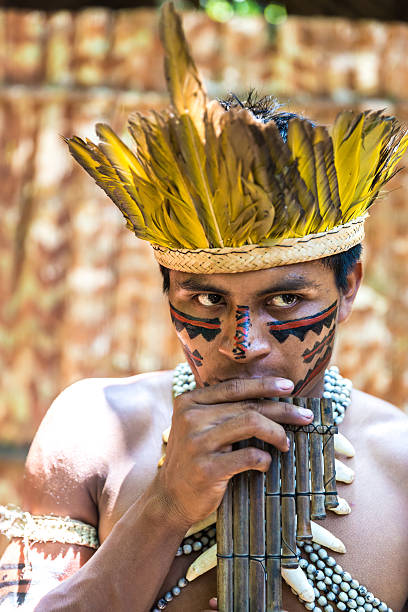 istock Native Brazilian playing wooden flute 495599906