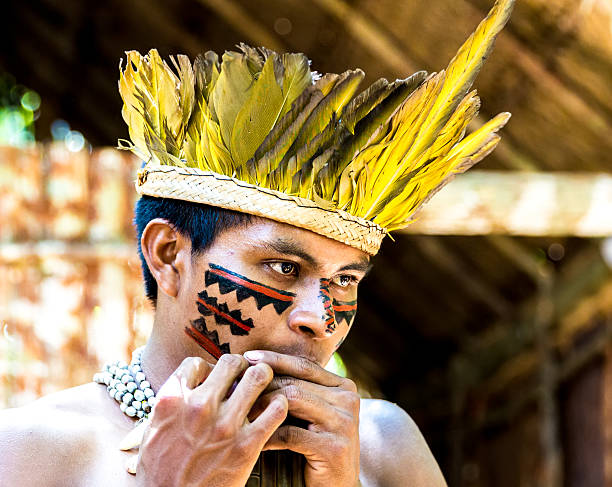 istock Native Brazilian playing wooden flute 495600062