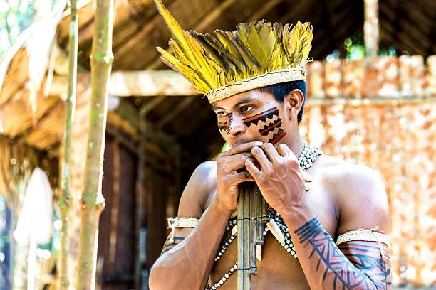 istock Native Brazilian playing wooden flute 495600136