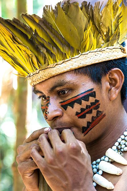 istock Native Brazilian playing wooden flute 495600222