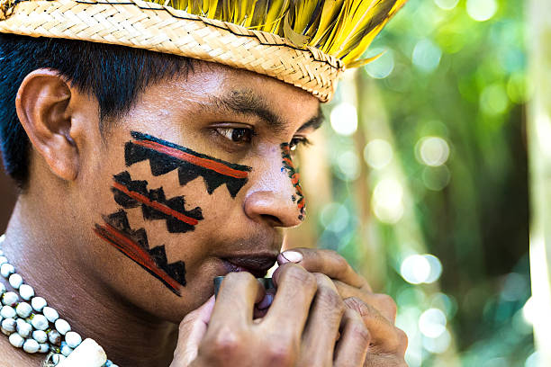 istock Native Brazilian playing wooden flute 495600464