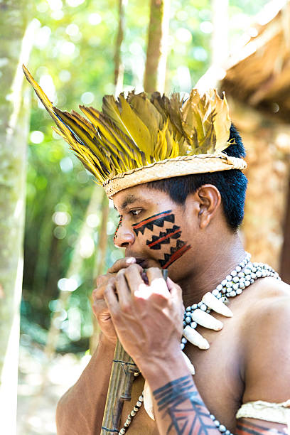 istock Native Brazilian playing wooden flute 495600564