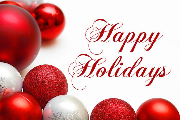 Group of Christmas Ornaments Framing Happy Holidays Text