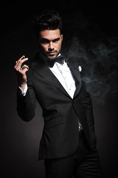 istock Handsome young business man enjoying a cigarette 495602648
