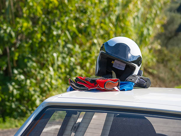 istock helmet and gloves on a car rooftop 495602948