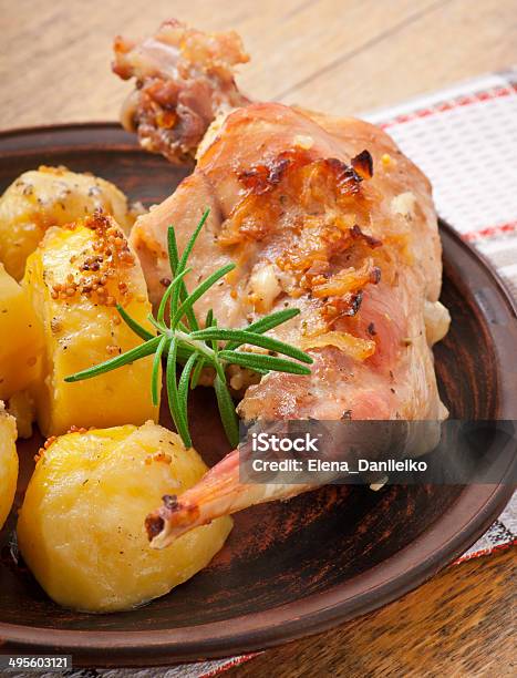 Oven Baked Rabbit Legs With Potatoes And Rosemary Stock Photo - Download Image Now - Animal Body Part, Animal Leg, Animal Limb