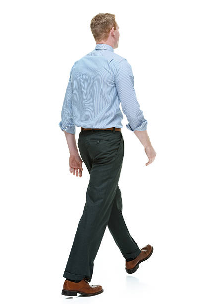 istock Rear view of businessman walking 495604235