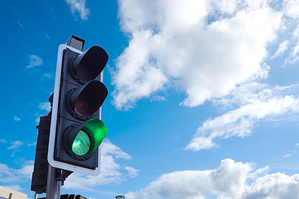 istock Green Traffic Light in the sky, freedom concept 495604901