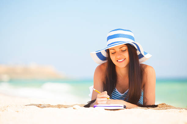 istock Young brunette girl with note and pencil 495605371