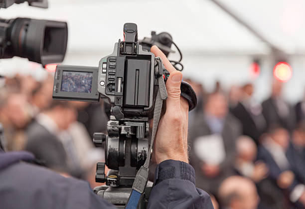 istock Filming an event with a video camera 495605874