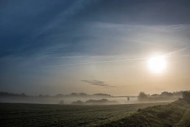 Foggy field in the Uckermark after sunrise in autumn 