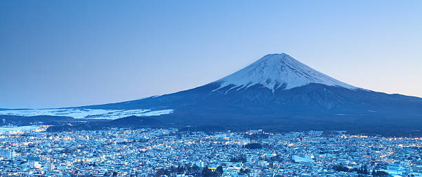 istock mountain fuji in winter from Fujiyoshida town 495607311