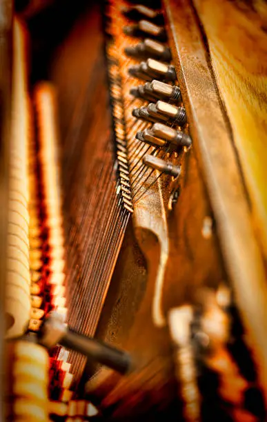 Inside view of an upright piano.