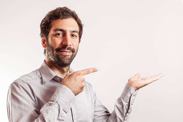 istock Young man give  thumbs up and make gesture with hand 495610117
