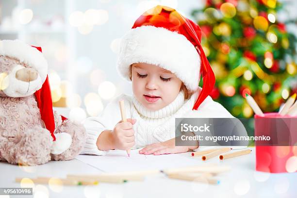 Child Before Christmas Writes A Letter To Santa Stock Photo - Download Image Now - 2015, Baby - Human Age, Baby Clothing