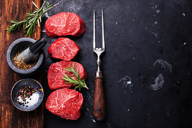istock Raw marbled meat Steaks with seasonings 495610892