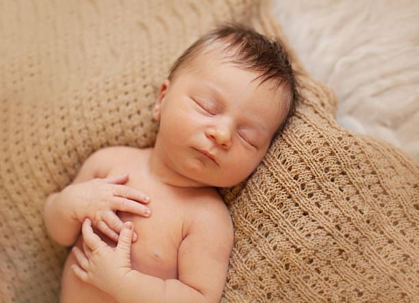 istock healthy newborn baby sleeping 495611506