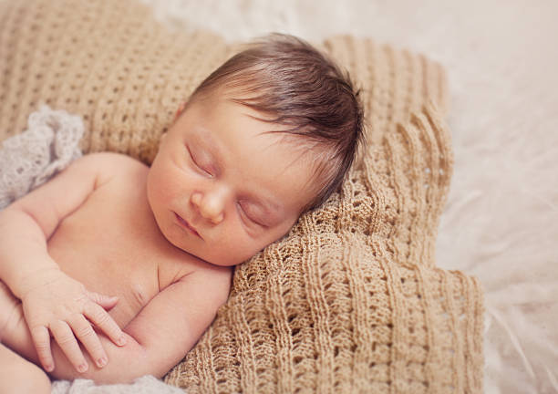 istock healthy newborn baby sleeping 495611742