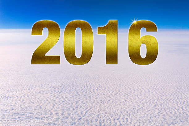 Golden textured number 2016 hovering in space high above a dense cloud front. Blue sky. Plenty of copy space. Simple, clean background illustration for happy new year 2016 greeting card or calendar.