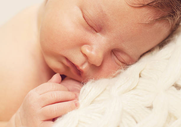istock healthy newborn baby sleeping 495612018