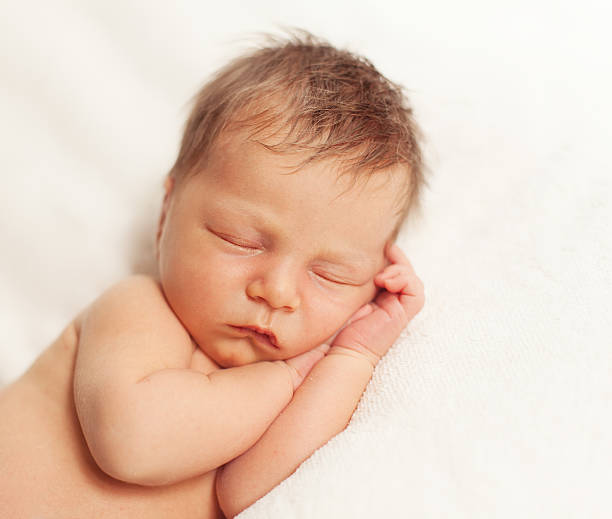 istock healthy newborn baby sleeping 495612532