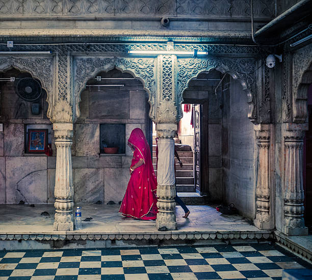 Deshnoke, India - September 30, 2015: People at the Karni Mata Temple. This is a famous Hindu temple dedicated to Karni Mata goddess in Deshnoke near Bikaner in the state of Rajasthan India. More than 20000 rats live in this temple and are considered holy. Thousand of people come here for blessings offering donation and food for the rats.