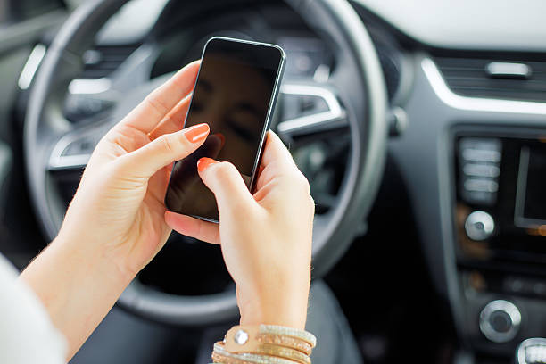 istock Female sitting in the car and texting 495613414