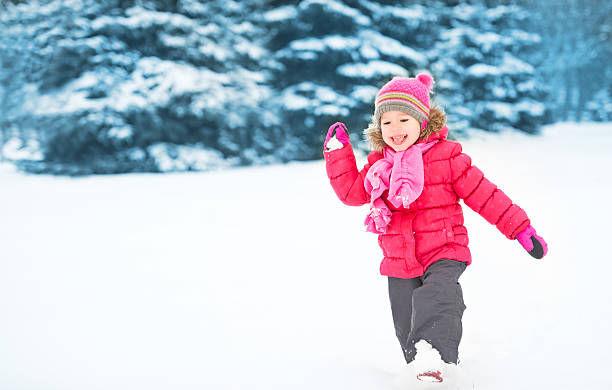 istock Happy child girl on a winter walk. 495613902