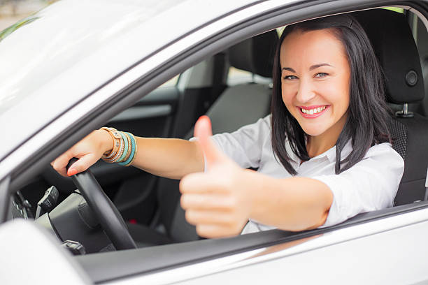 istock Female driver showing thumbs up 495614430