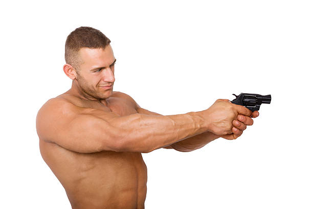 istock Muscular caucasian man with gun. 495617252