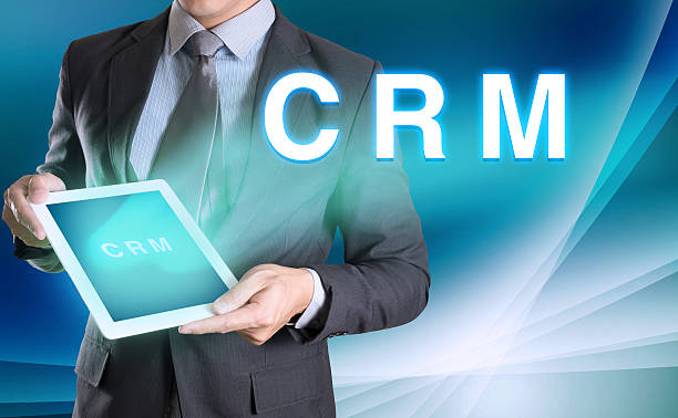 istock businessman holding computer tablet in hand and show CRM,(Custom 495617322
