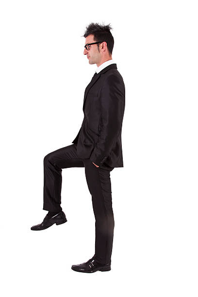 istock businessman with raised foot 495617518