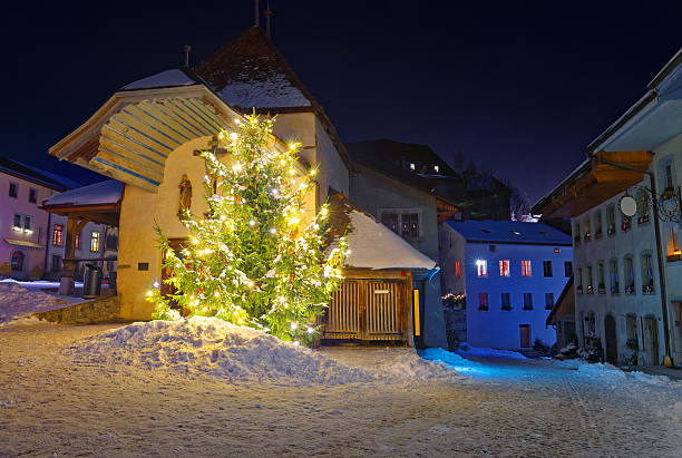 istock Night view of the illuminated Christmas fir tree 495623090