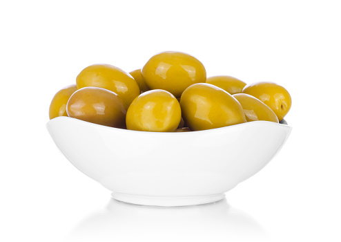 Fresh olives in a bowl, isolated on white
