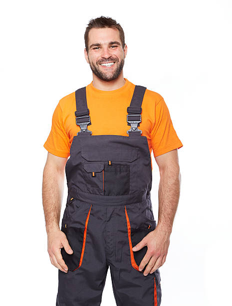 istock Portrait of smiling worker in blue uniform 495625255