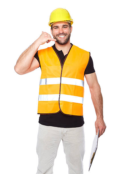 istock Smiling man in work clothes making a call me sign 495625281