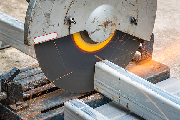 istock Cutting a square metal and steel with compound mitre saw 495625390