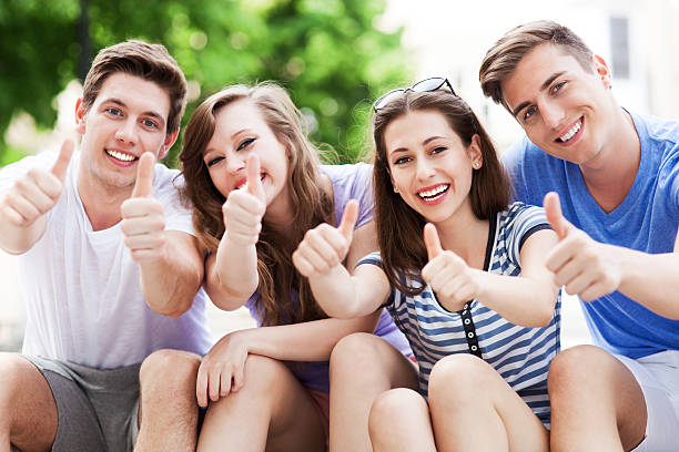 istock Young people with thumbs up 495627097