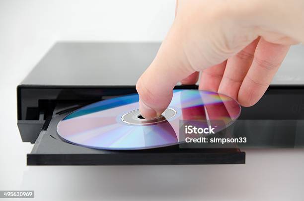 Disc Insterted To Dvd Or Cd Player Stock Photo - Download Image Now - DVD, Playing, Men