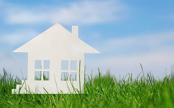 istock Paper house on green grass over blue sky. Concept 495632049