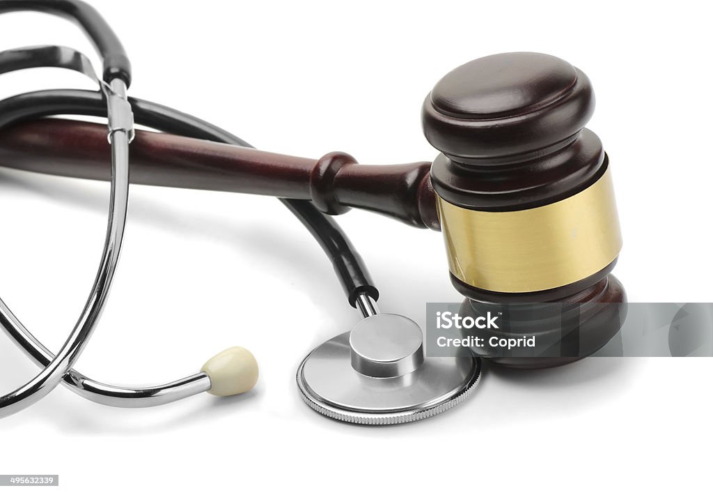 Stethoscope and gavel Close up of stethoscope and gavel on white background Healthcare And Medicine Stock Photo