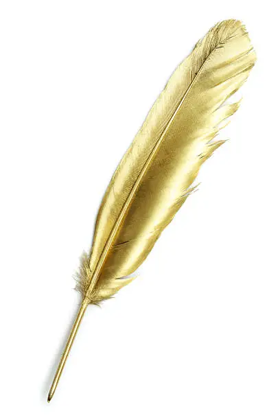 Unusual gold quill pen on a white paper