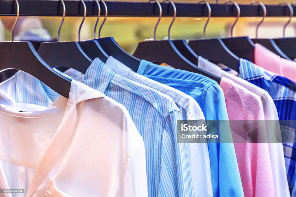 Clothes A row of clothes hanging on the rack 2015 Stock Photo