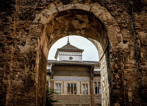 Seville, Spain - August 11, 2015: Beautiful gateway and architecture within the Alcazar of Seville. Photo taken during a wam summer day, and has no people.