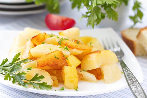 istock Roast potatoes with fresh herbs and vegetables 495639854