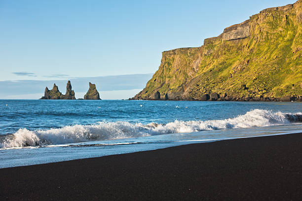 istock Waves at black volcanic sand beach in Vik at sunrise 495644686